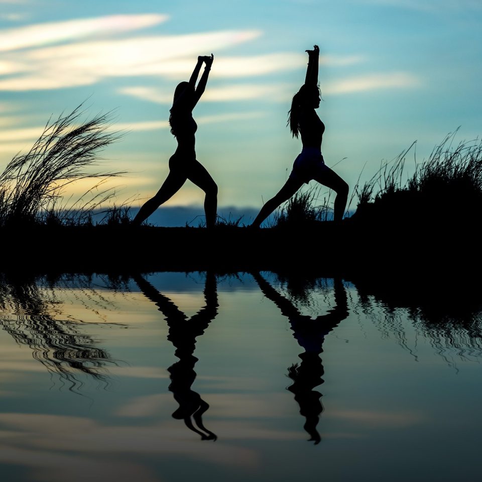 women, yoga, silhouettes, water, reflection, mirroring, water reflection, pose, posing, yoga pose, meditation, stretching, wellness, well-being, exercise, adults, asia, nature, girls, morning, outdoors, pair, people, stance, sunrise, sunset